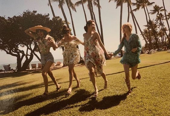 Blackpink running on the grass in Hawaii