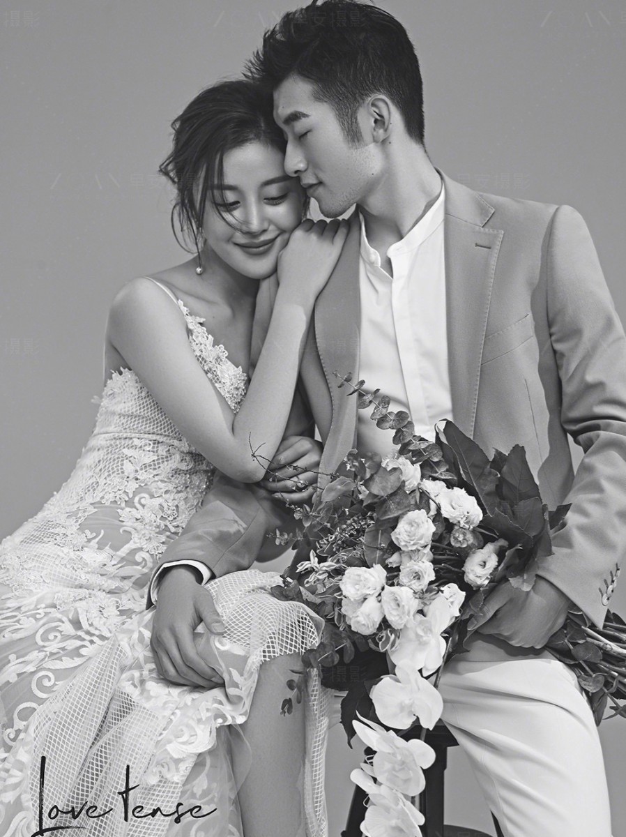 Bride rests head on groom's shoulder