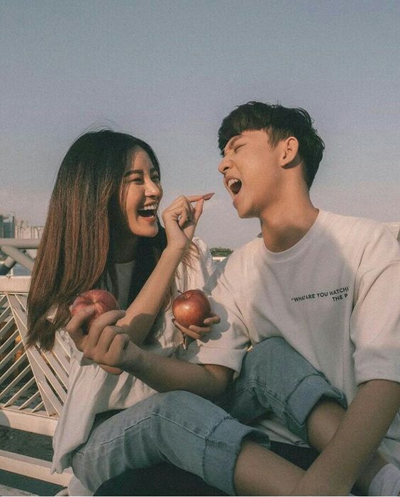 Girlfriend feeding boyfriend