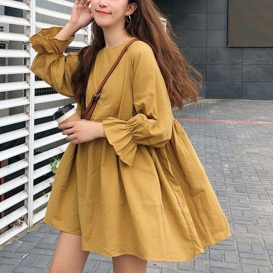 Korean girl wearing a vintage yellow babydoll dress