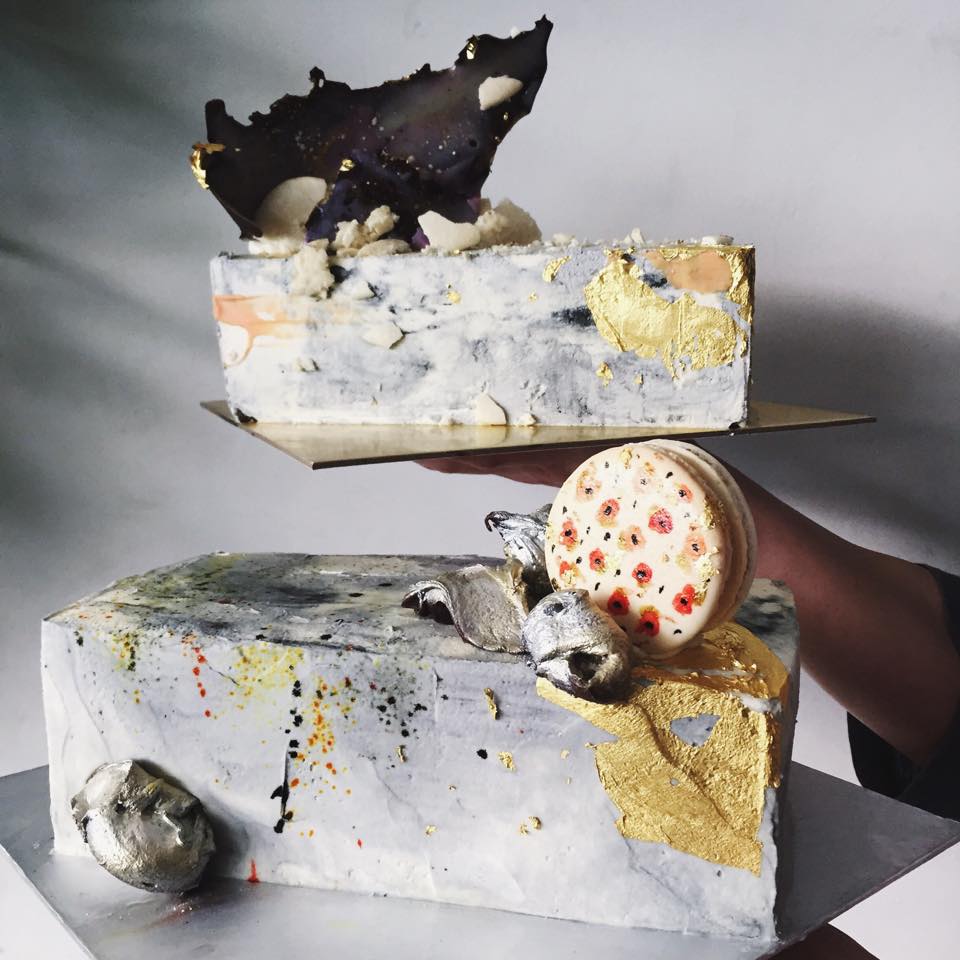 Cupplets cake with splatter paint decoration and a macaron