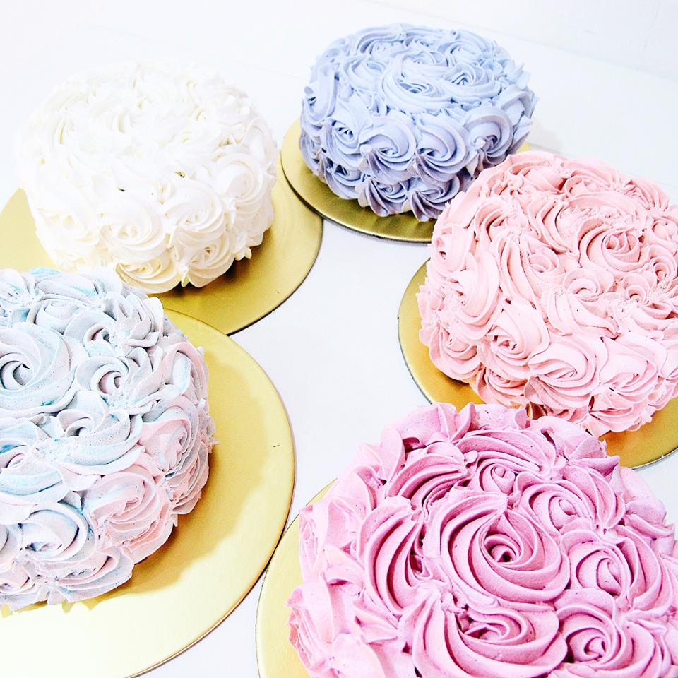 Spatula Whimsical Series cakes with rose piping in different pastel shades