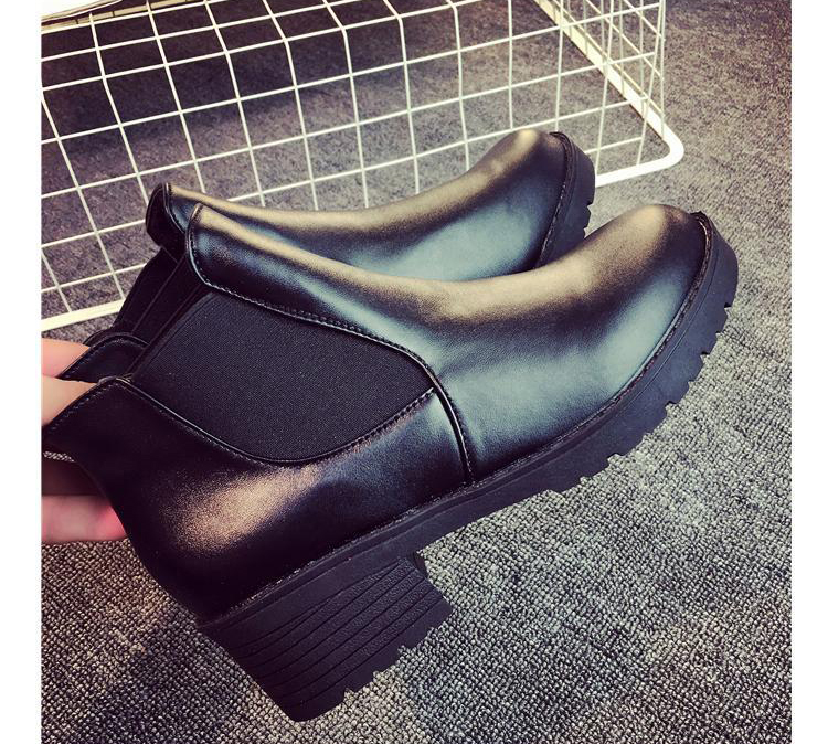 Classic black boots product shot