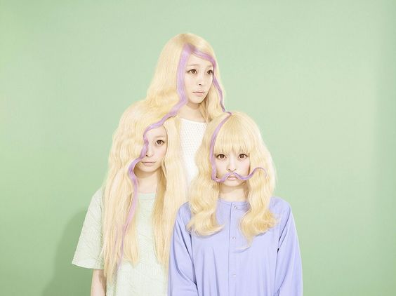 kyary pamyu pamyu digitally edited to have 3 versions of her with their hair entangled into each others'