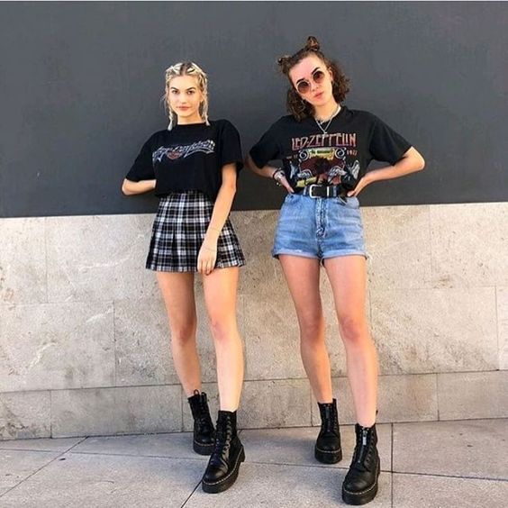 two girls wearing Band tee + shorts or jeans