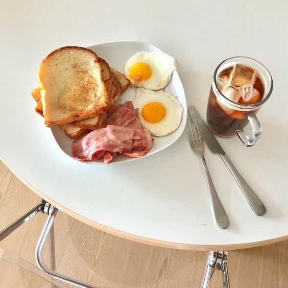 Breakfast with eggs bacon and coffee