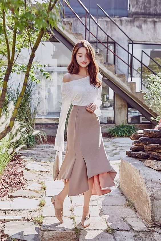 korean woman wearing a Full maxi skirt and fitted top