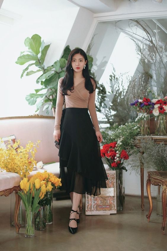 korean woman wearing a Full maxi skirt and fitted top