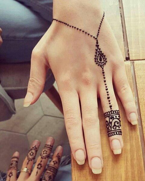 minimalist henna tattoos on hands