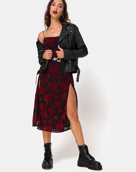 girl wearing Daxita Dress in Romantic Red Rose Flock, a leather jacket and boots