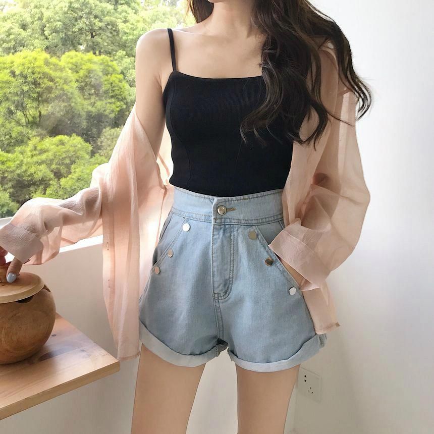 black camisole and denim shorts
