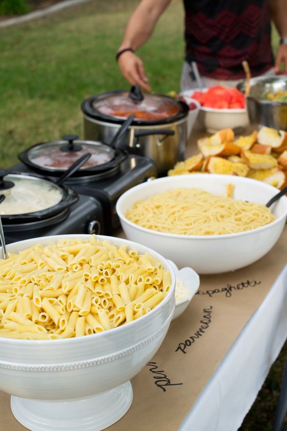 buffet with different types of pasta and sauces