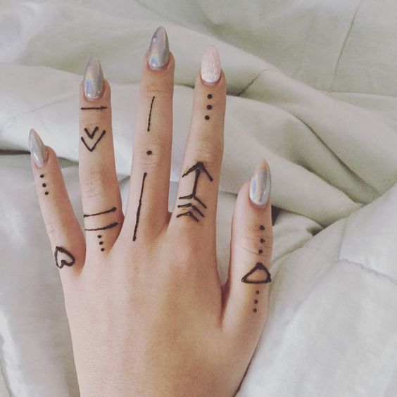 minimalist henna tattoos on hands