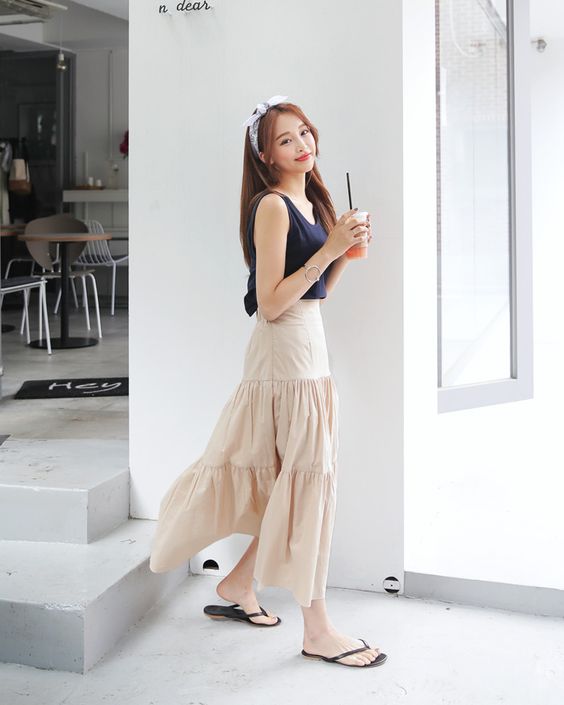 korean woman wearing a Full maxi skirt and fitted top