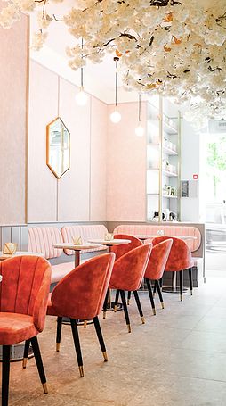 Interior of FEYA with plush pink chairs