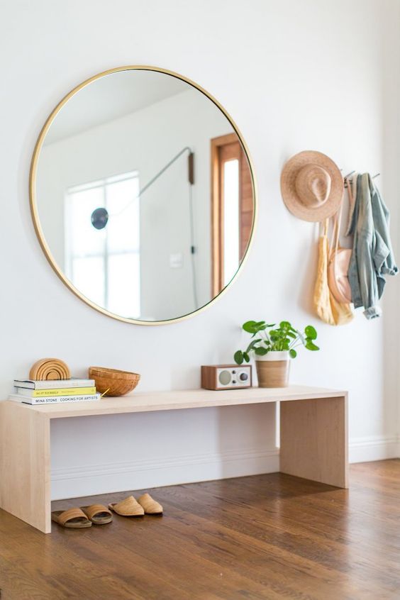 Big round mirror with wooden decorations