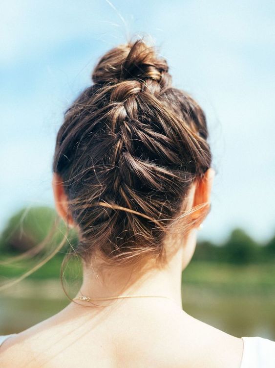 girl with dutch braids into a bun