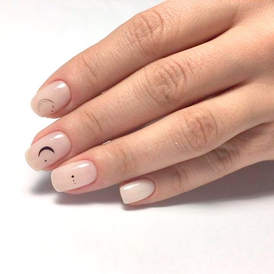 minimalist nude natural nails with a moon and star