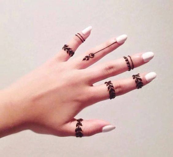 minimalist henna tattoos on hands