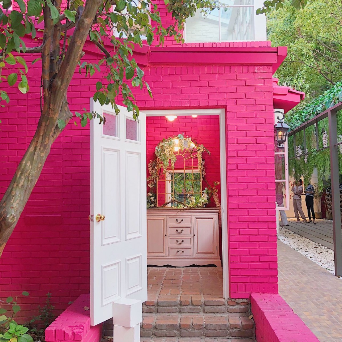 white door to pink background