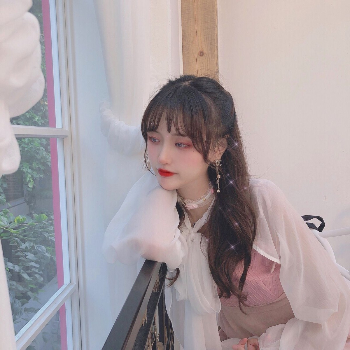 girl looking out window