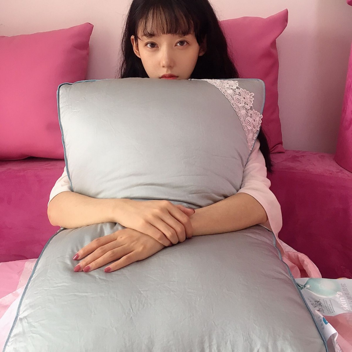 girl hugging pillow