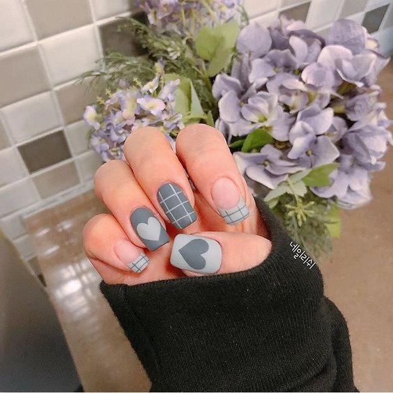 Blue matte nails with heart designs