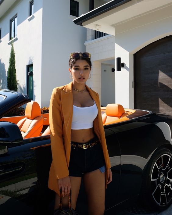 woman wearing a orange blazer