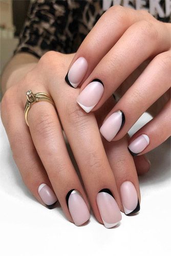 nude nails with black and white details