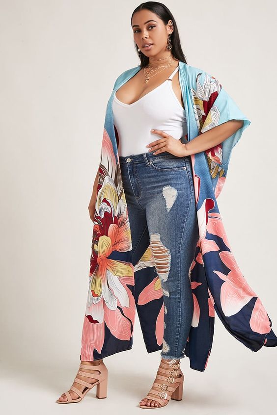woman wearing awhite top, jeans and kimono