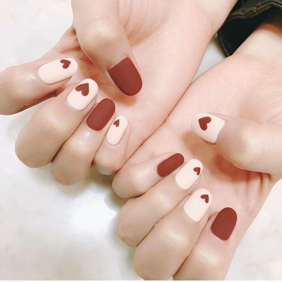 Red and white matte nails with heart design