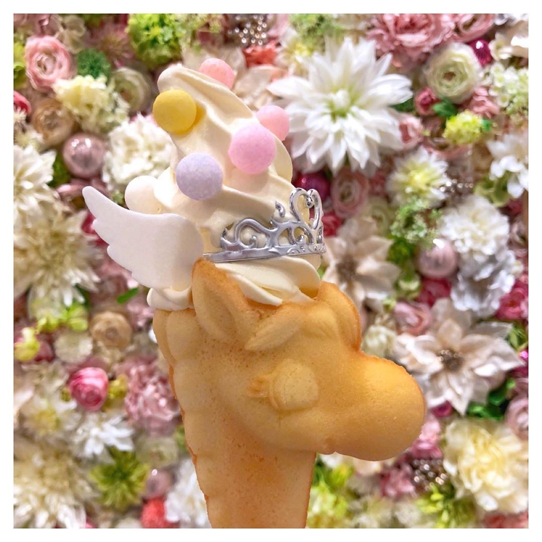 Asakusa Tsuno Koi ice cream in front of flower wall