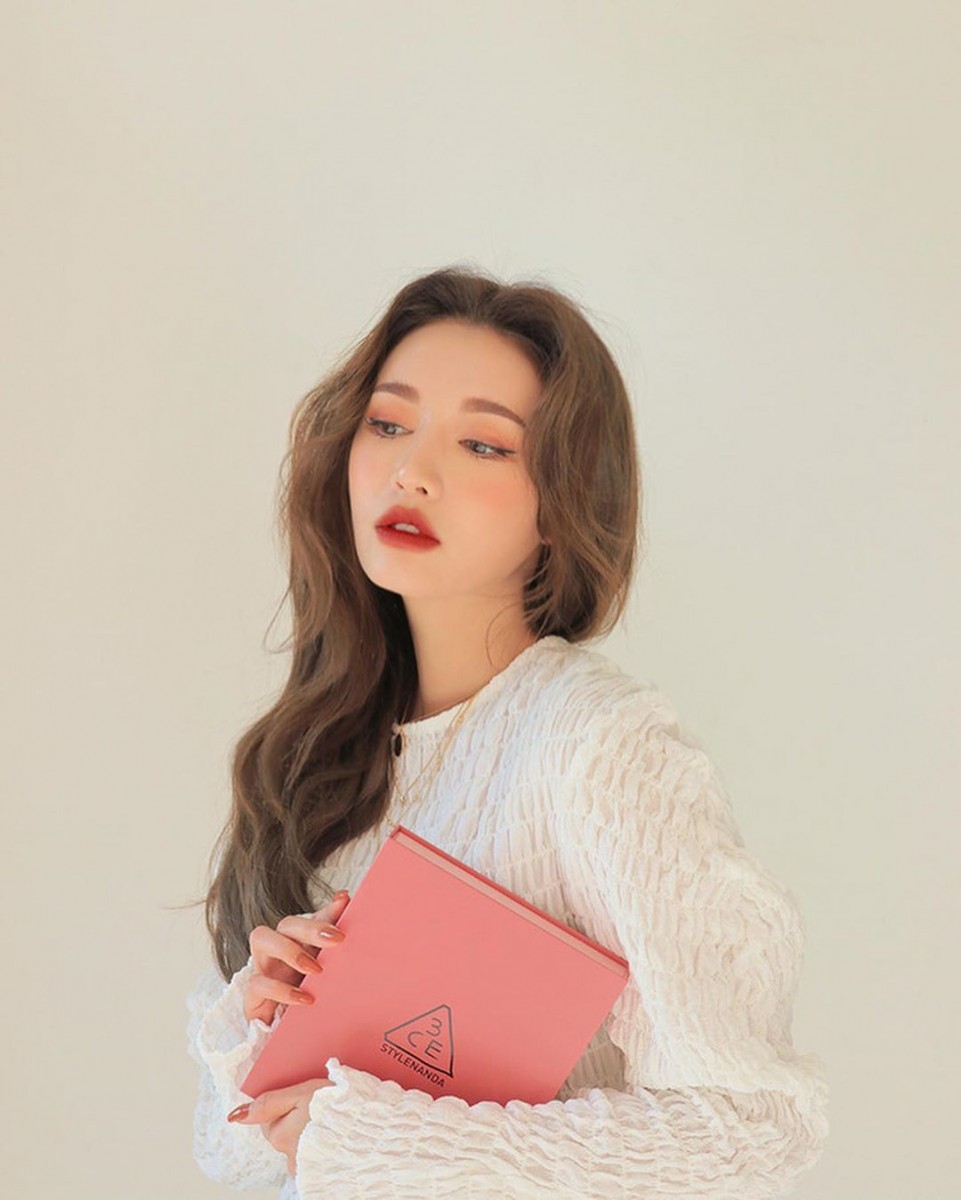 girl holding pink book