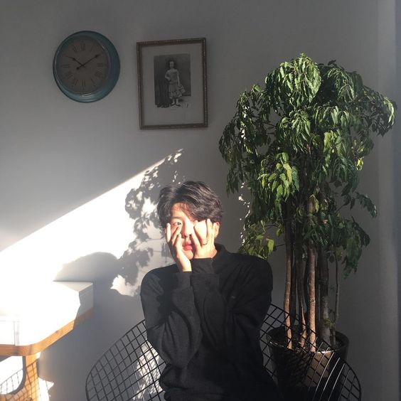 asian guy with hands on his face