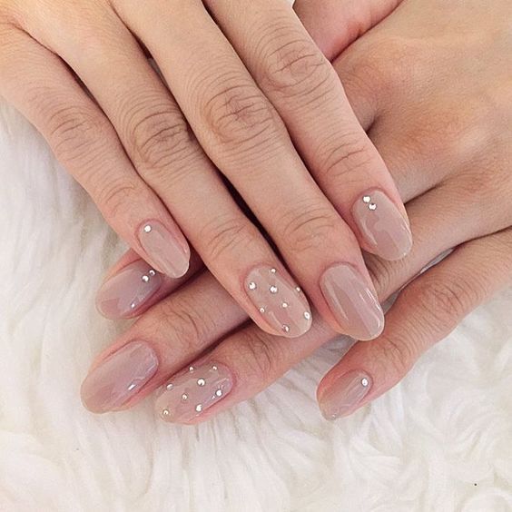 nude nails with silver spots