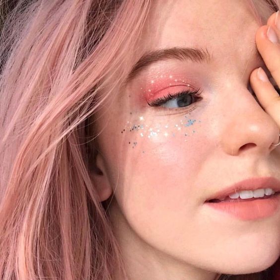 girl with pink hair and chunky glitter makeup