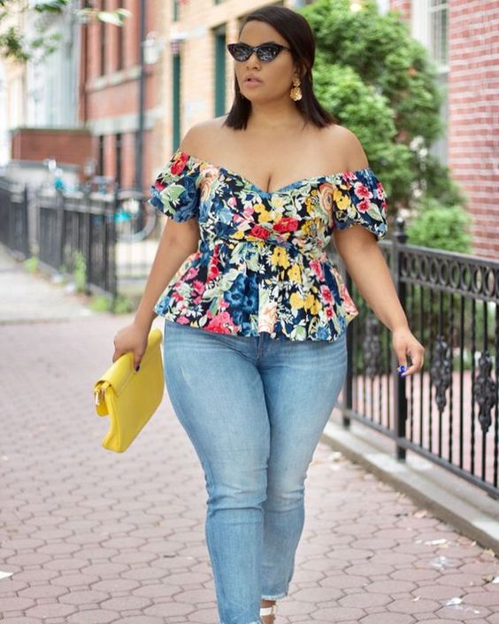 woman wearing an off shoulder top and jeans