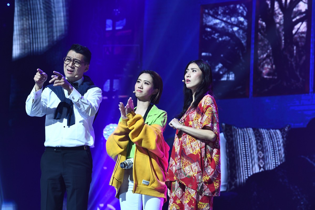 Three hosts doing a skit