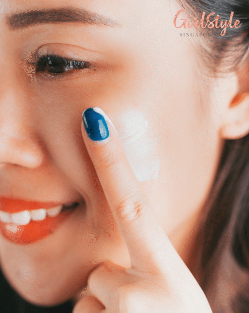 Model applying multi-action fluid on cheek