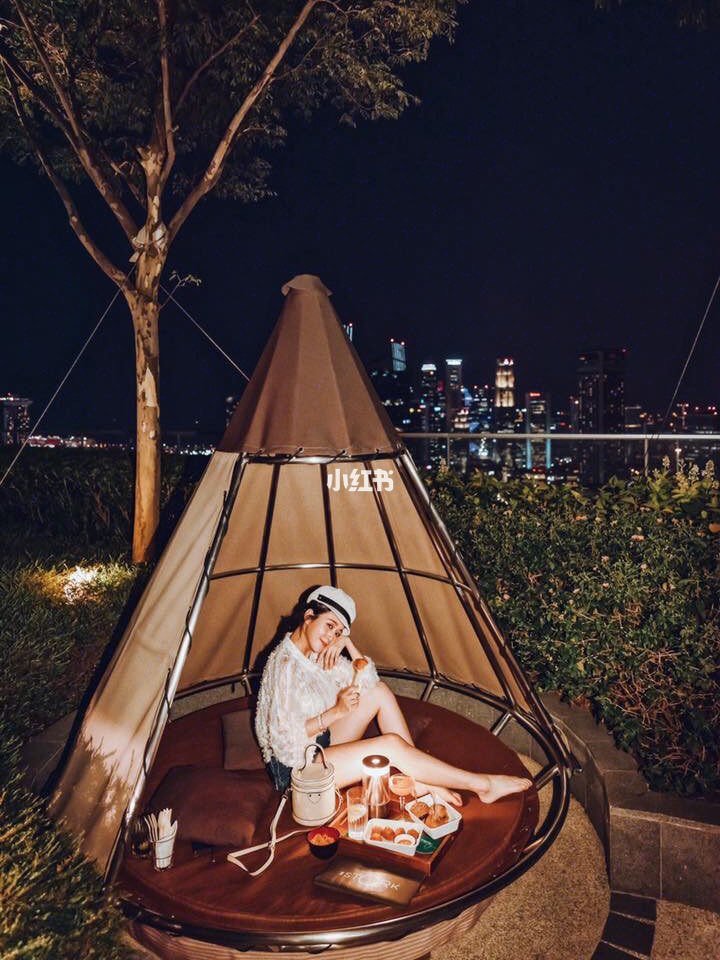 Girl sitting in the teepee hut at Mr. Stork
