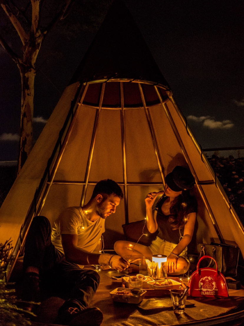 Couple in teepee hut at Mr. Stork