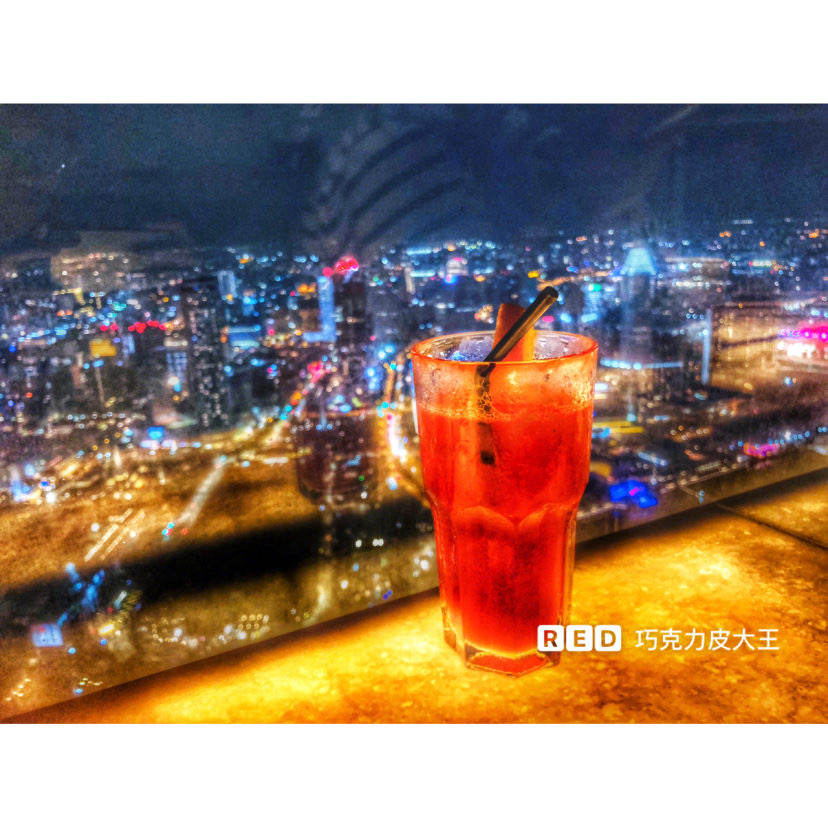 Cocktail with night view at 1-Altitude