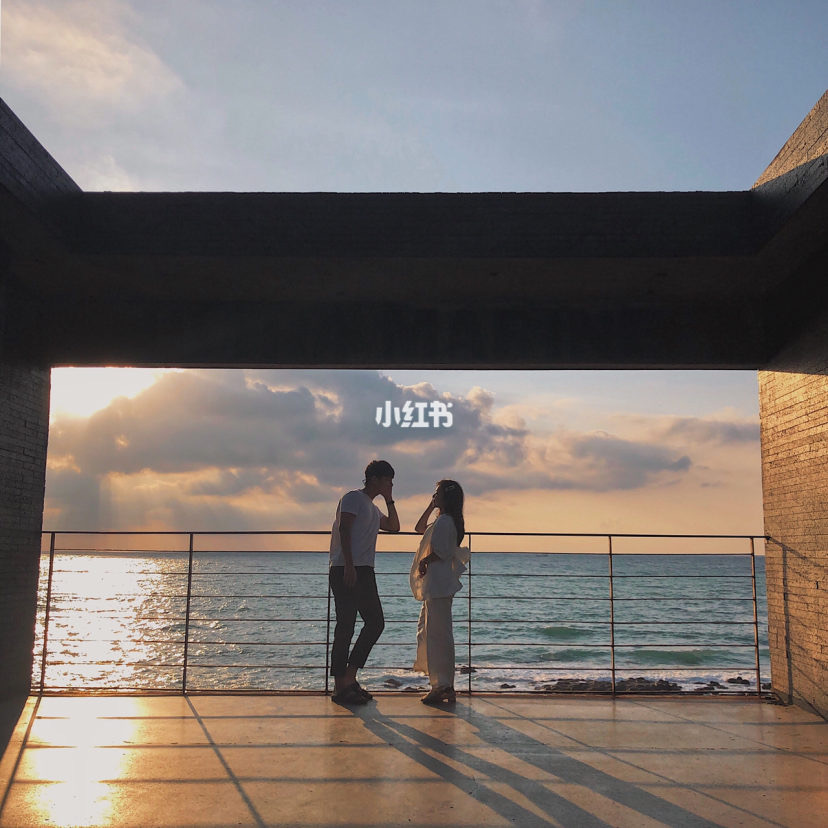 Couple looking at each other with sea as the background