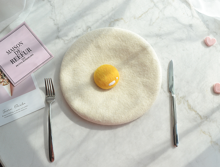 Fried egg hat with utensils