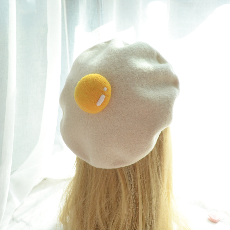 Fried egg hat worn on wig