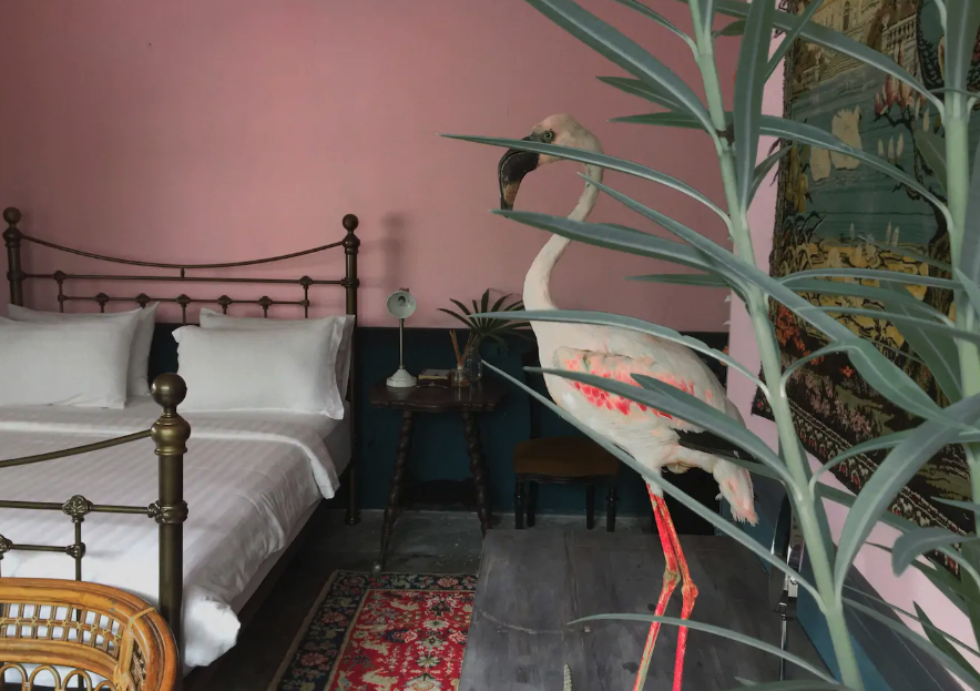 Bed area of The Flamingo room