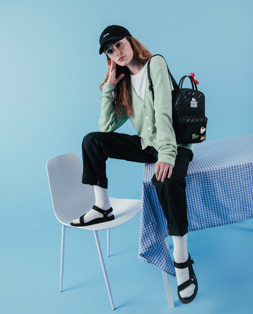 Model wearing the hello kitty mini backpack