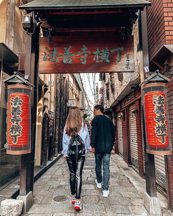 couple in tokyo, japan with red lanterns