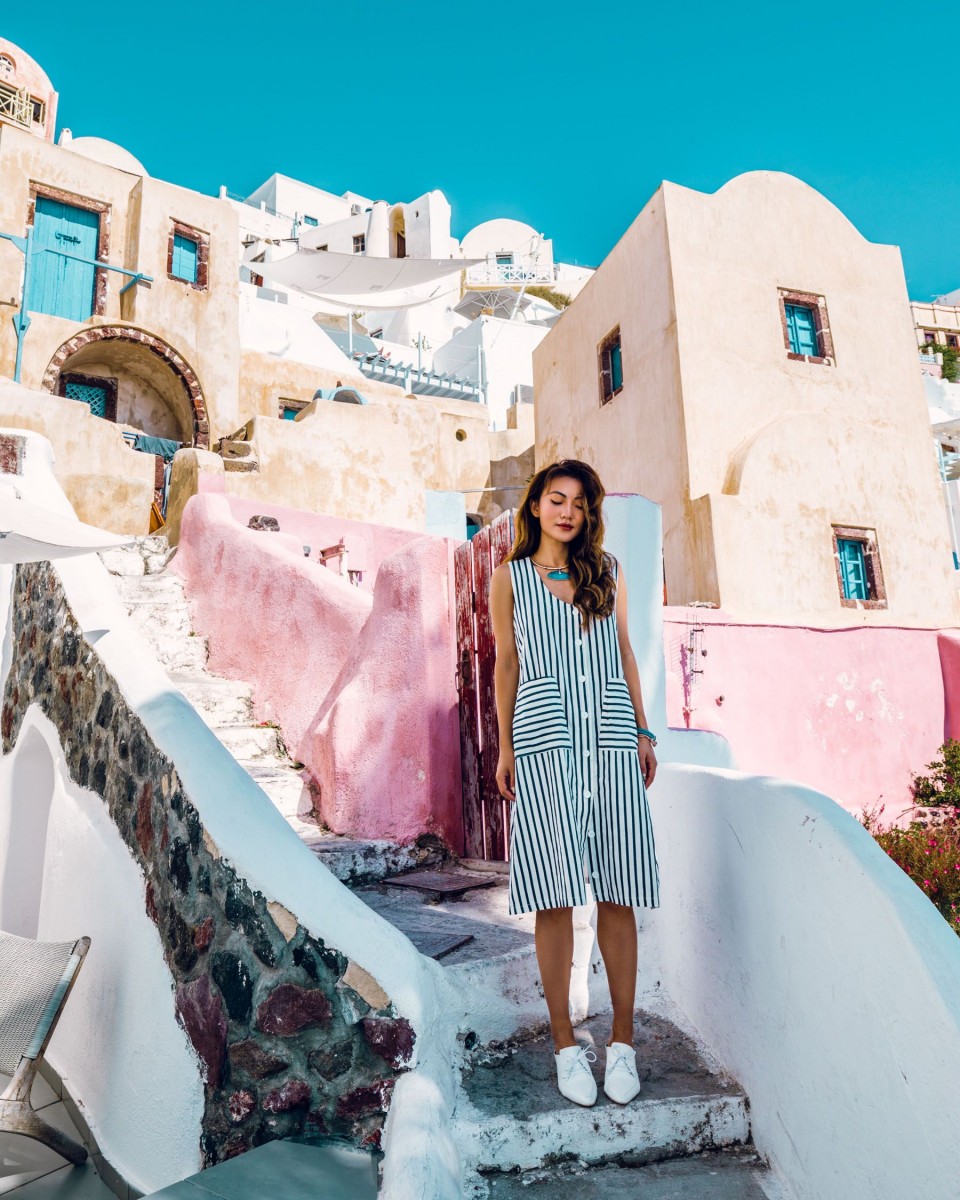 asian girl in greece with colourful architecture