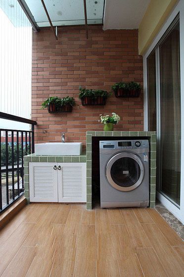 laundry area with washing machine at balcony